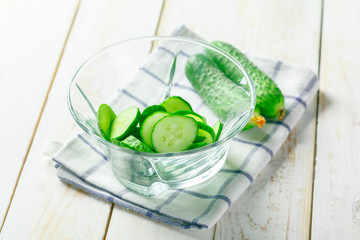  cucumbers on wooden background