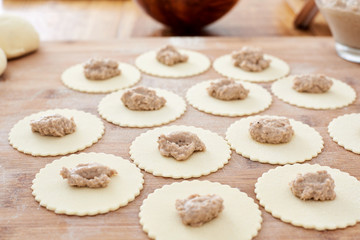 Making mezzelune handmade pasta