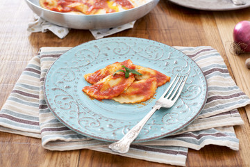 Mezzelune handmade pasta with tomato sauce