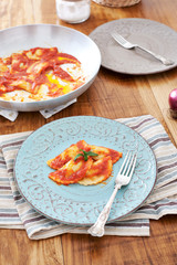 Mezzelune handmade pasta with tomato sauce