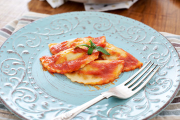 Mezzelune handmade pasta with tomato sauce