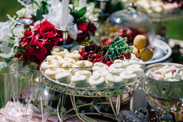 beautiful sweets and flowers on the table