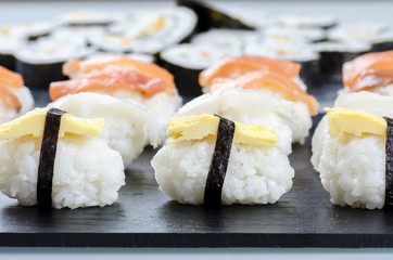 Sushi nigiri set on slate plate.