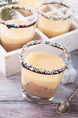 Chocolate dessert with Custard cream. Delicious Christmas themed dinner table.