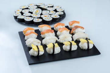 Sushi nigiri set and  makis on slate plate.