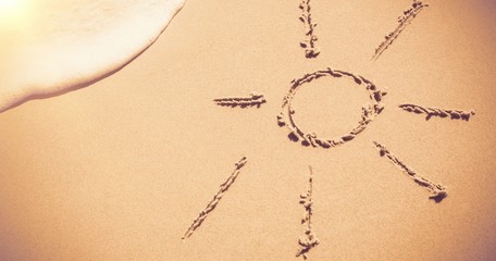 Sun drawn on sand