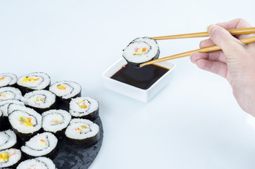 Maki sushi, rolls on slate plate.