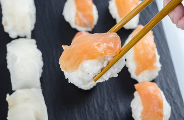 Sushi nigiri set on slate plate.