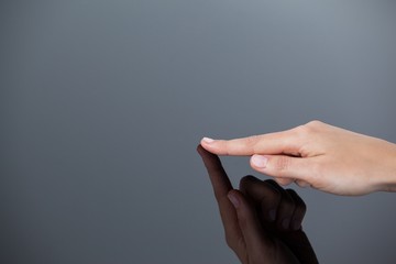 Hand of a woman touching glass