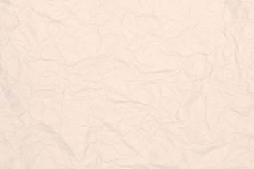 Crumpled light brown paper texture or paper background.  Closeup white paper detail for design with copy space for text or image.