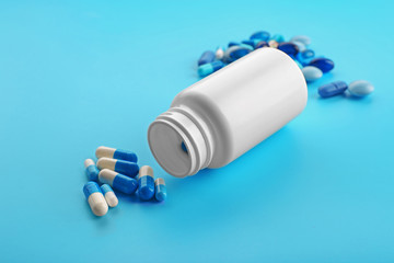 Heap of pills on blue background