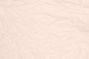 Recycled crumpled light brown paper texture or paper background.  Closeup light brown paper detail for design with copy space for text or image.