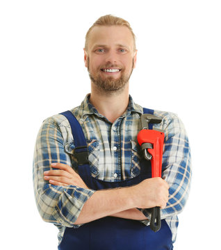 Portrait of handsome plumber with pipe wrench isolated on white