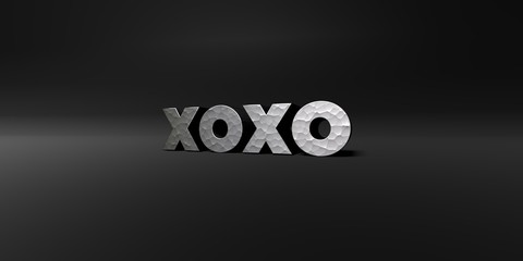 XOXO - hammered metal finish text on black studio - 3D rendered royalty free stock photo. This image can be used for an online website banner ad or a print postcard.