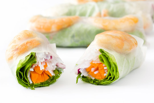Vietnamese rolls with vegetables, rice noodles and prawns isolated on white background

