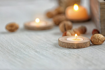 Candle in wooden holder, closeup