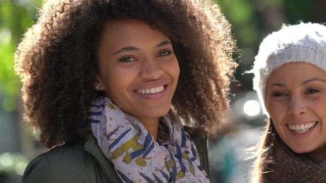 Closeup of cheerful girls laughing outloud together