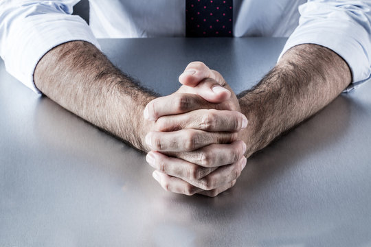 anonymous leader hands waiting or thinking at meeting or interview