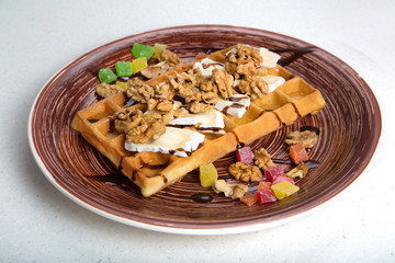 Plate of belgian waffles with cheese and nuts