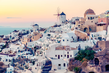 Fototapeta premium Oia village at sunset, Santotini island, Greece. Instagram vintagestyle