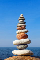 Concept of balance and harmony. stones balance on the background of the sea
