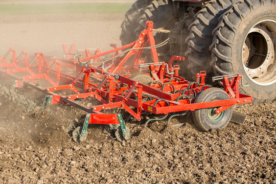 Close up shot of seedbed cultivator machine at work