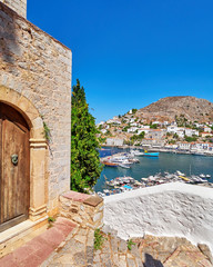 Greece, vintage wooden door and  Hydra island  port view