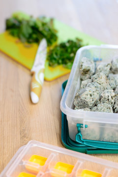 Frozen vegetables and cutting board and plastic containet with knife