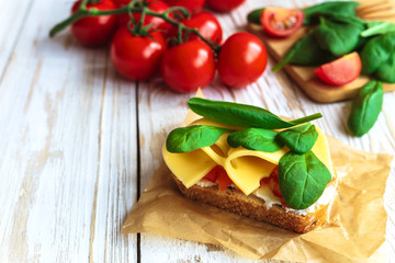 Bruschetta with spinach and cherry tomatoes on toasted baguette