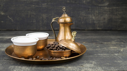 Fototapeta na wymiar Turkish coffee with traditional copper serving set