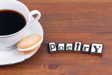 Poetry. On wooden table coffee mug, cookie