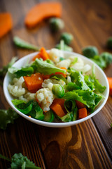 salad of lettuce, cauliflower and Brussels sprouts with a pumpkin