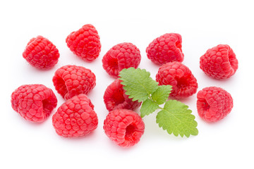Ripe raspberry with leaf isolated on the white background.