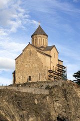 Fototapeta na wymiar Metekhi Church above the Kura river in Tbilisi, Georgia.