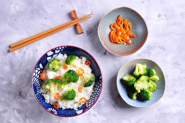 Boiled rice and broccoli with olive oil and chili pepper.