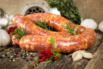 Raw sausages with peppercorn and rosemary