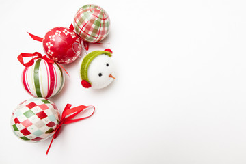 decorations for christmas tree on white backgrounds, snowman and colorful balls