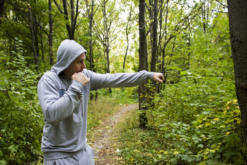 the young man in the woods,training in Boxing