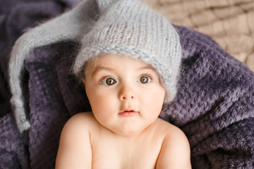 Incredible and charming newborn baby lying on soft blanket