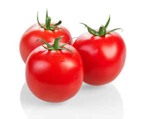 Three ripe tomatoes closeup isolated on white.