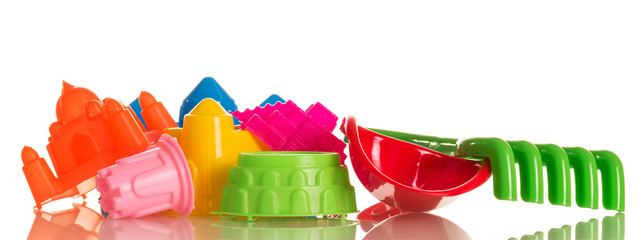Bright toys for playing in sandbox isolated on white background