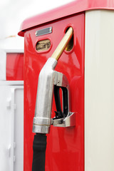 VIntage car refueling. Close-up old red gas pump. Traveling concept.