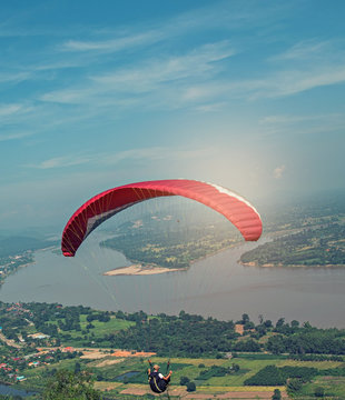 One man paragliding during autumn evenings, beautiful landscape. .