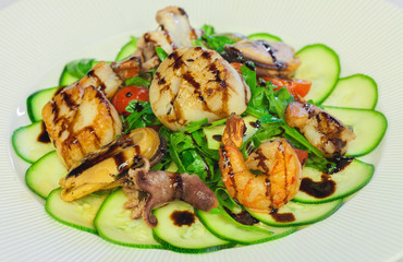 Seafood Salad with baby octopus, shrimp, mussels, scallops, tomatoes, arugula