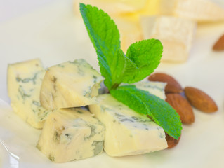Blue cheese close-up with grape and nuts