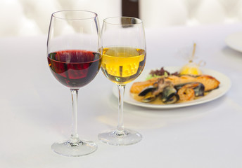 white and red wine in glasses