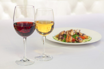 white and red wine in glasses
