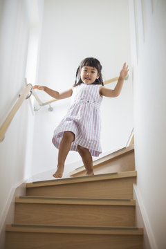 Girl walking down stairs