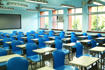 Empty classroom with desks and chairs