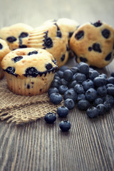 muffin with blueberries on a wooden table. fresh berries and swe